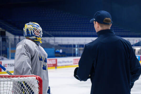 Goaltender Jesper Wallstedt and goaltender coach Anthon
