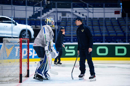 Goaltender Jesper Wallstedt and goaltender coach Anthon