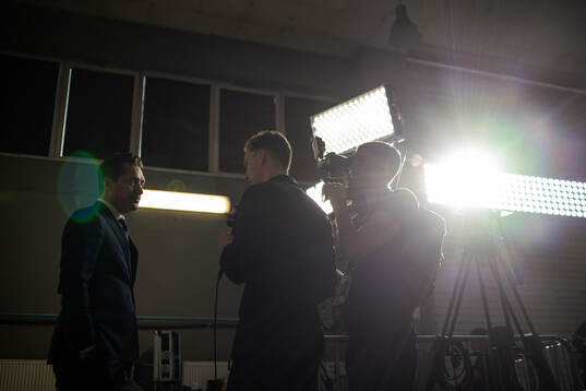 Head coach Sam Hallam of Sweden is interviewed by Ludvig