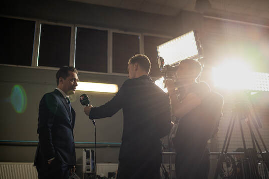 Head coach Sam Hallam of Sweden is interviewed by Ludvig