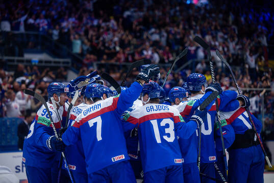 Players of Slovakia celebrate the overtime win