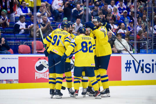 Erik Karlsson of Sweden celebrate with teammates