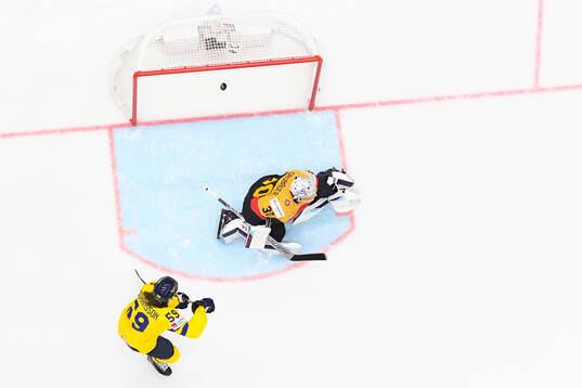 goaltender Philipp Grubauer of Germany and Linus Johansson