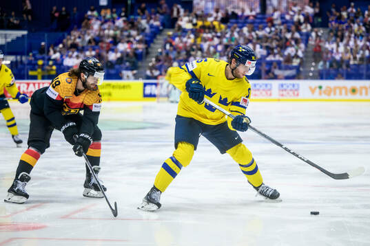 André Burakovsky of Sweden and Wojciech Stachowiak of