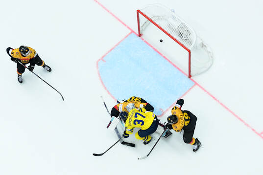 goaltender Philipp Grubauer of Germany and Isac Lundeström