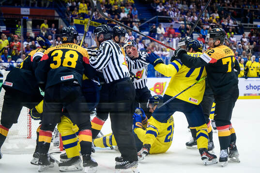 Fighting between players of Germany and of Sweden