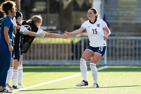 Niamh Peacock of England celebrates