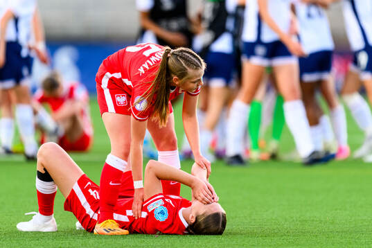 Anna Krakowiak and Magda Piekarska of Poland  looks dejected