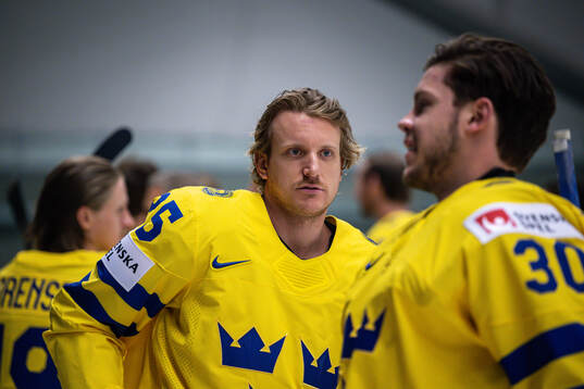 Jonas Brodin and goaltender Jesper Wallstedt of Sweden at a