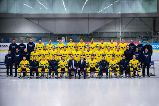Players and staff of Sweden pose for a team group photo