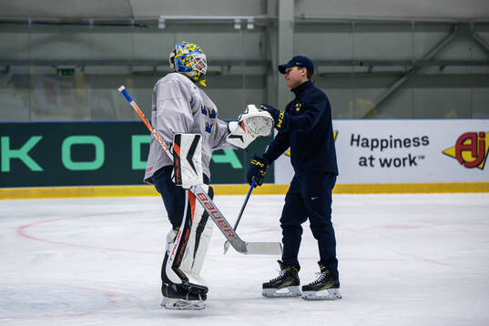 Goaltender Samuel Ersson and head coach Sam Hallam of