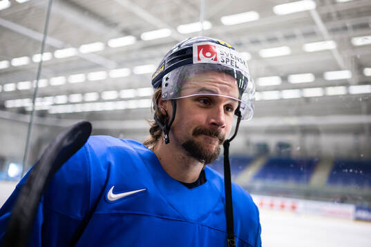 Erik Karlsson of Sweden speaks with media