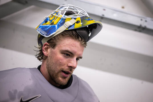 Goaltender Samuel Ersson of Sweden speaks with media