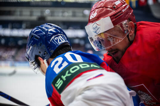 Juraj Slafkovsky of Slovakia and Mateusz Bryk of Poland