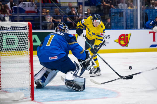 goaltender Nikita Boyarkin of Kazakhstan and Marcus
