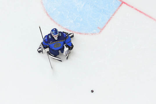 goaltender Nikita Boyarkin of Kazakhstan looks dejected