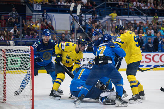 Joel Eriksson Ek of Sweden and goaltender Nikita Boyarkin