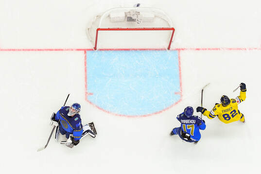 Goaltender Nikita Boyarkin of Kazakhstan looks dejected
