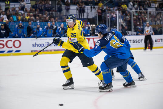 Rasmus Dahlin of Sweden and Nikolay Shulga Kazakhstan