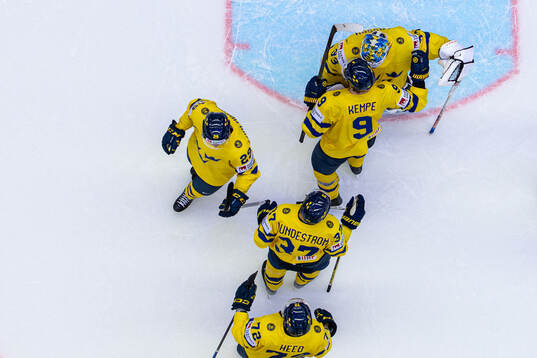 Goaltender Samuel Ersson of Sweden celebrate with Adrian