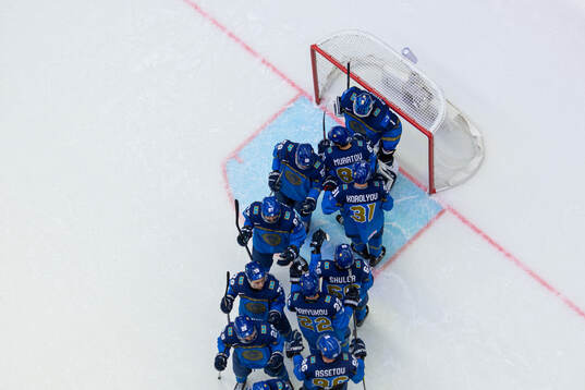 Players of Kazakhstan with goaltender Nikita Boyarkin