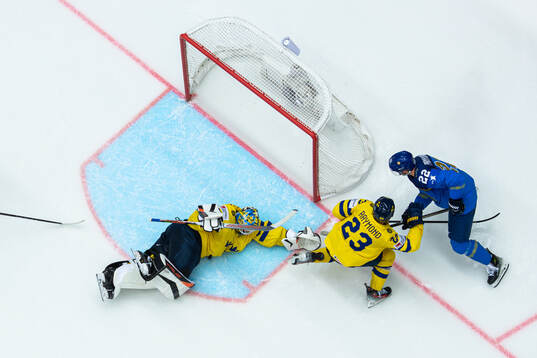 Goaltender Samuel Ersson and Lucas Raymond of Sweden
