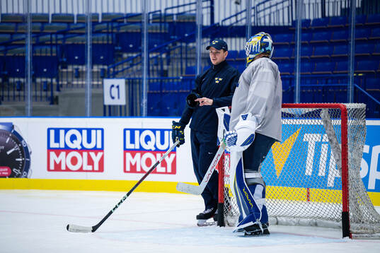 Goaltender coach Anthon Hansson and goaltender Jesper