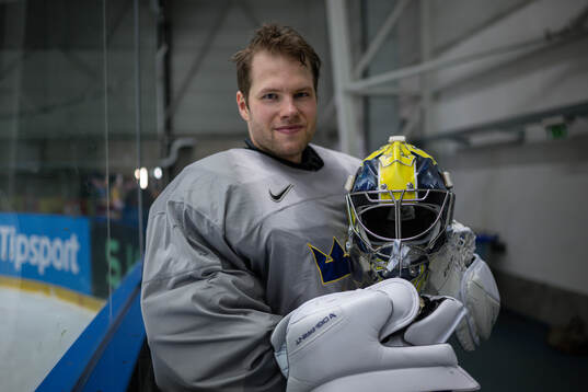 Goaltender Filip Gustavsson of Sweden poses for a picture