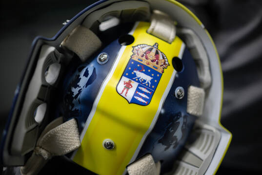 Goaltender Filip Gustavsson shows his helmet