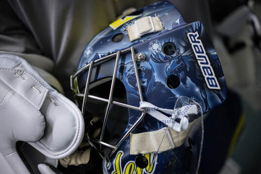 Goaltender Filip Gustavsson shows his helmet