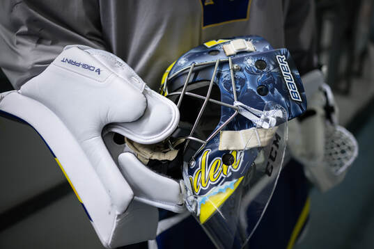 Goaltender Filip Gustavsson shows his helmet