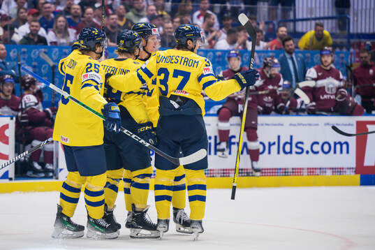 Rasmus Dahlin of Sweden celebrate with teammates