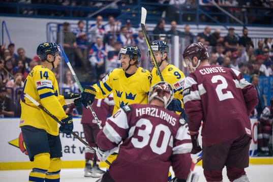 Jonas Brodin of Sweden celebrates
