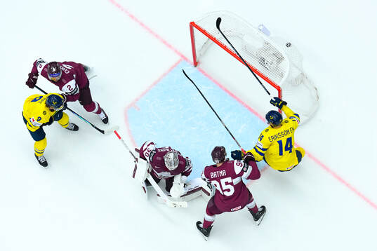 Adrian Kempe and Joel Eriksson Ek of Sweden against