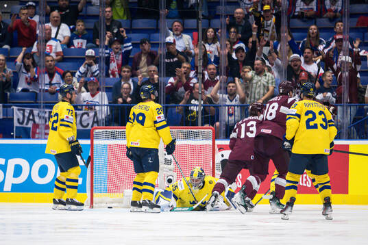 goaltender Filip Gustavsson of Sweden looks dejected