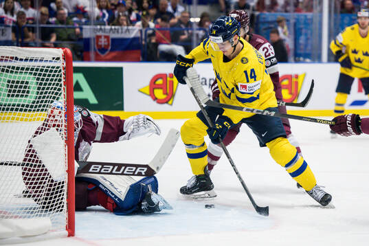 duringgoaltender Kristers Gudlevskis of Latvia and Joel