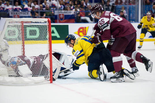 Joel Eriksson Ek of Sweden and Arvils Bergmanis of Latvia
