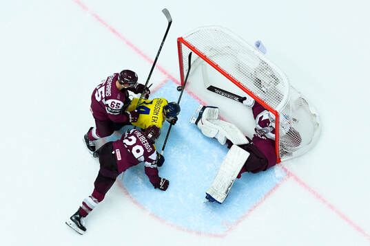 Joel Eriksson Ek of Sweden against Arvils Bergmanis, Ralfs