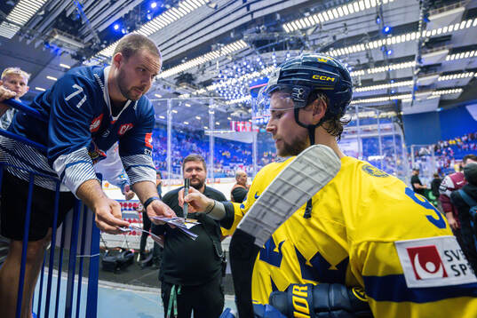 Adrian Kempe of Sweden signs an autopgraph