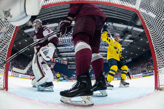 Lucas Raymond of Sweden celebrates a goal behind goaltender