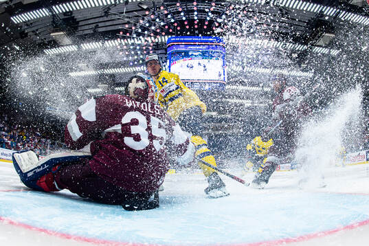 Goaltender Kristers Gudlevskis of Latvia and Joel Eriksson