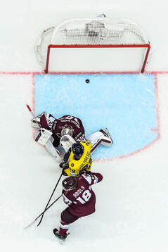 Pontus Holmberg of Sweden sees Joel Eriksson Ek of Sweden