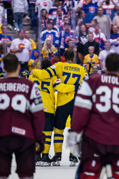 Erik Karlsson and Victor Hedman of Sweden embrace each other