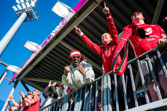 Spectators in the stands celebrates