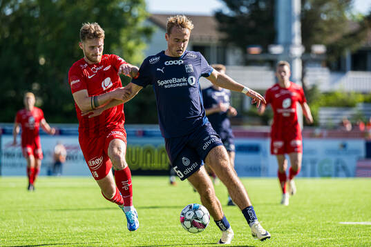 Ole Didrik Blomberg of Brann and Mikkel Rakneberg of