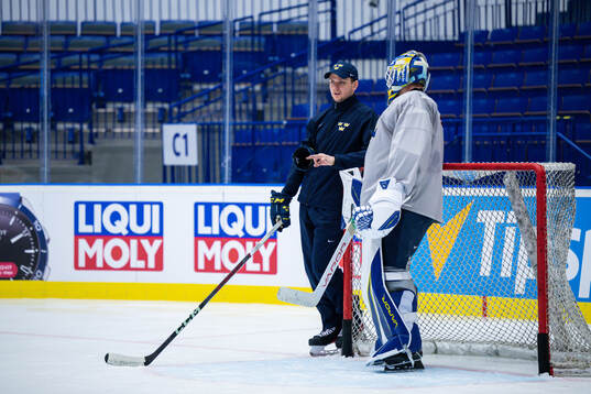 Goaltender coach Anthon Hansson and goaltender Jesper