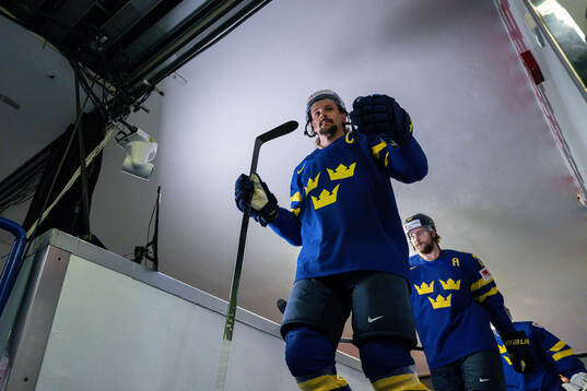 Erik Karlsson and Victor Hedman of Sweden enter the ice