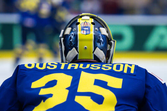 The back of goaltender Filip Gustavsson of Sweden