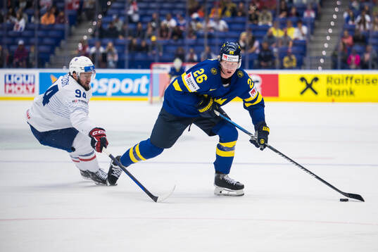 Tim Bozon of France and Rasmus Dahlin of Sweden