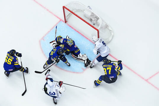 Charles Bertrand of France scores the 1-1 goal behind